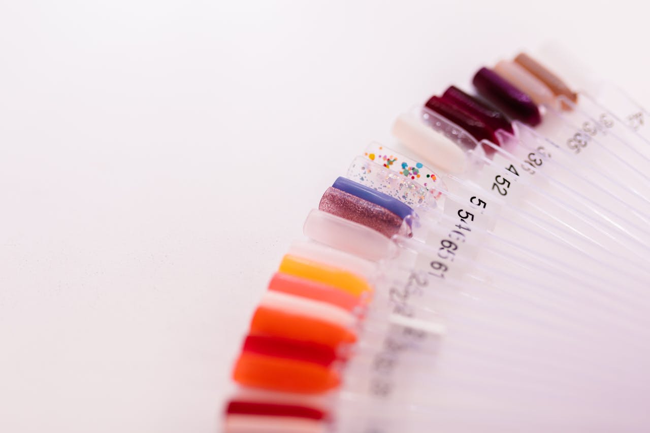 Showcasing a variety of vibrant nail polish colors on display sticks for selection.